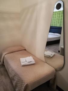 Posteľ alebo postele v izbe v ubytovaní Hotel Bruman