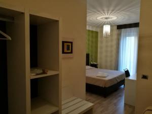 Posteľ alebo postele v izbe v ubytovaní Hotel Bruman