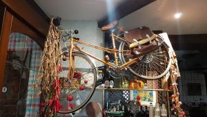 a bicycle hanging on a wall in a store at Hotel Colegiata in Santillana del Mar