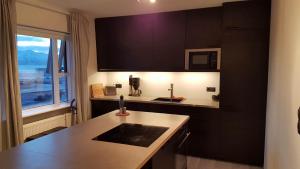 Η κουζίνα ή μικρή κουζίνα στο Post-Plaza Guesthouse