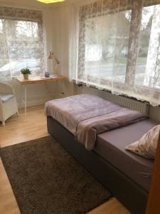 Ένα ή περισσότερα κρεβάτια σε δωμάτιο στο Nordsee-Lilie