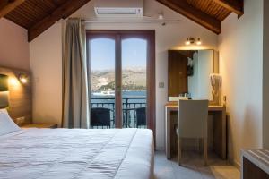 Posteľ alebo postele v izbe v ubytovaní Hotel Aggelos Kefalonia
