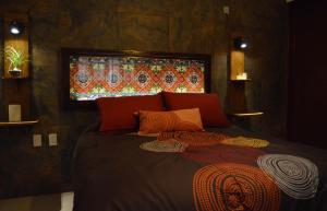 Postel nebo postele na pokoji v ubytování Hotel Las Candelas de Huamantla