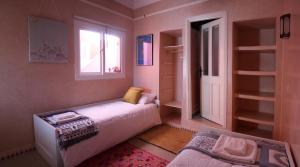 Кровать или кровати в номере Tifawin Apartment
