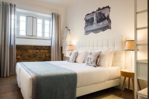 Postel nebo postele na pokoji v ubytování Loulé Coreto Guesthouse