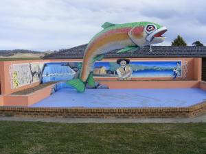 a painting of a fish on the side of a building at Big Trout Motel in Oberon