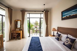 Postel nebo postele na pokoji v ubytování Santa Sea Villa + 37 fotografií