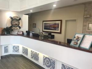 a lobby of a dental office with a counter at The Clan Terrigal in Terrigal