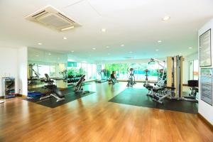 a gym with treadmills and exercise equipment in a room at Aston Kiara Suites in Kuala Lumpur