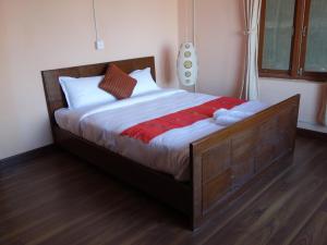 Postel nebo postele na pokoji v ubytování Bodhi Apartment hotel