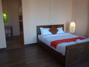 Postel nebo postele na pokoji v ubytování Bodhi Apartment hotel