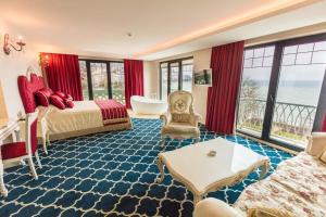 a hotel room with a bed and a view of the ocean at Sinema Hotel Ordu in Ordu