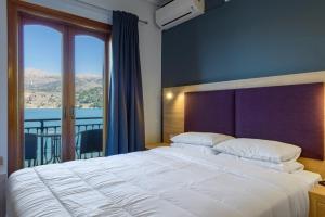 Posteľ alebo postele v izbe v ubytovaní Hotel Aggelos Kefalonia