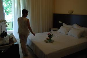 Postel nebo postele na pokoji v ubytování Hotel Achillion