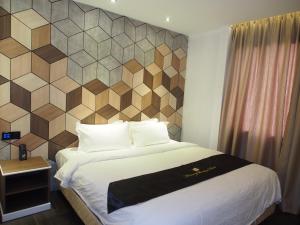 Postel nebo postele na pokoji v ubytování Mercury Boutique Hotel