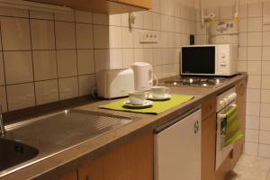 A kitchen or kitchenette at Ildikó Apartman