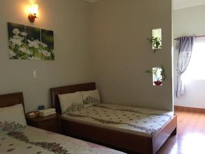 Postel nebo postele na pokoji v ubytování Anh Duong Hotel