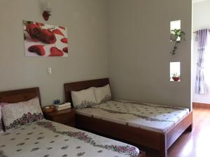 Postel nebo postele na pokoji v ubytování Anh Duong Hotel