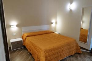 Posteľ alebo postele v izbe v ubytovaní B&B Il Campanile