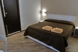 Posteľ alebo postele v izbe v ubytovaní B&B Il Campanile