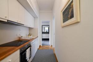 A kitchen or kitchenette at Athens Squared Apartments
