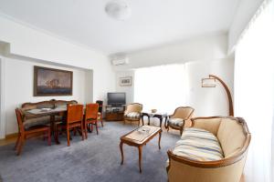 A television and/or entertainment centre at Athens Squared Apartments