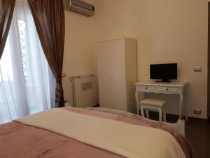 Posteľ alebo postele v izbe v ubytovaní B&B La Perla Bianca