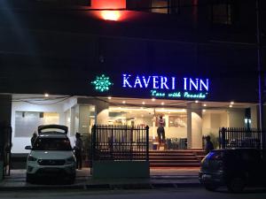 a car parked in front of a store at night at Kaveri Inn in Kathmandu