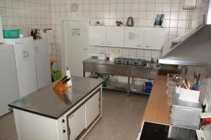 Kuchyň nebo kuchyňský kout v ubytování Gästehaus zur Linde