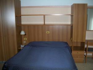 Ένα ή περισσότερα κρεβάτια σε δωμάτιο στο Albergo Corradetti
