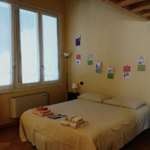 a bedroom with a bed with two towels on it at B&B Casa Pascolone in Pegognaga