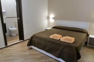 Posteľ alebo postele v izbe v ubytovaní B&B Il Campanile