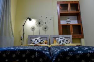 Postel nebo postele na pokoji v ubytování Nana's Home