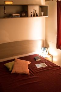 Ein Bett oder Betten in einem Zimmer der Unterkunft New Camping Le Tamerici