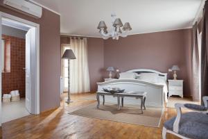 Postel nebo postele na pokoji v ubytování Villa Sara
