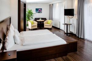 Postel nebo postele na pokoji v ubytování Hotel Bolte + 35 fotografií