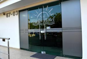 a building with a sign on the door of a hotel at Sol Caribe Hotel in Soledad +8 photos