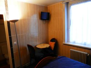 Postel nebo postele na pokoji v ubytování Hotel du Gambrinus