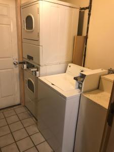 a kitchen with a dishwasher and a washer at Motel 6 Rock Hill SC in Rock Hill