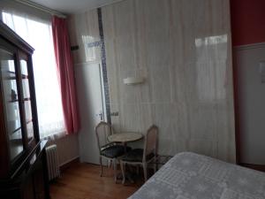 Postel nebo postele na pokoji v ubytování Hotel du Gambrinus