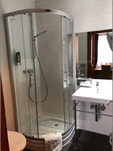 a bathroom with a shower and a sink at Hotel Vogelweiderhof in Salzburg