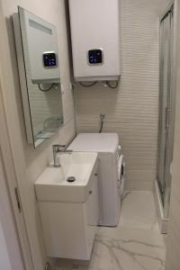 a small bathroom with a sink and a mirror at Casa Rados Fazana in Fažana +100 photos