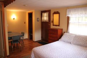 Säng eller sängar i ett rum på Phoenicia Lodge