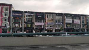 a building with many signs on the side of it at Non Smoking Theda Evo Soho Bangi with Coway & Wifi - Pool Tutup in Bangi