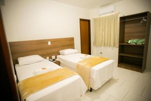 Cama ou camas em um quarto em Hotel Folley