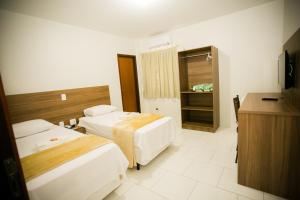 Cama ou camas em um quarto em Hotel Folley