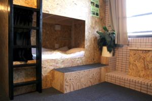 Llit o llits en una habitació de Guesthouse Masago