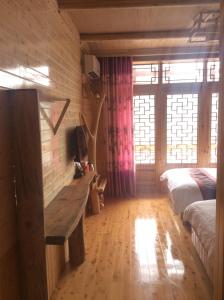 Cama o camas de una habitación en Yangjiajie Inn
