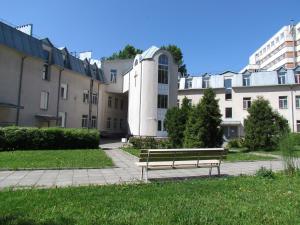 a park bench in front of a building at Logos in Saint Petersburg