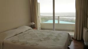 Postel nebo postele na pokoji v ubytování Laguna del Mar La Serena + 41 fotografií